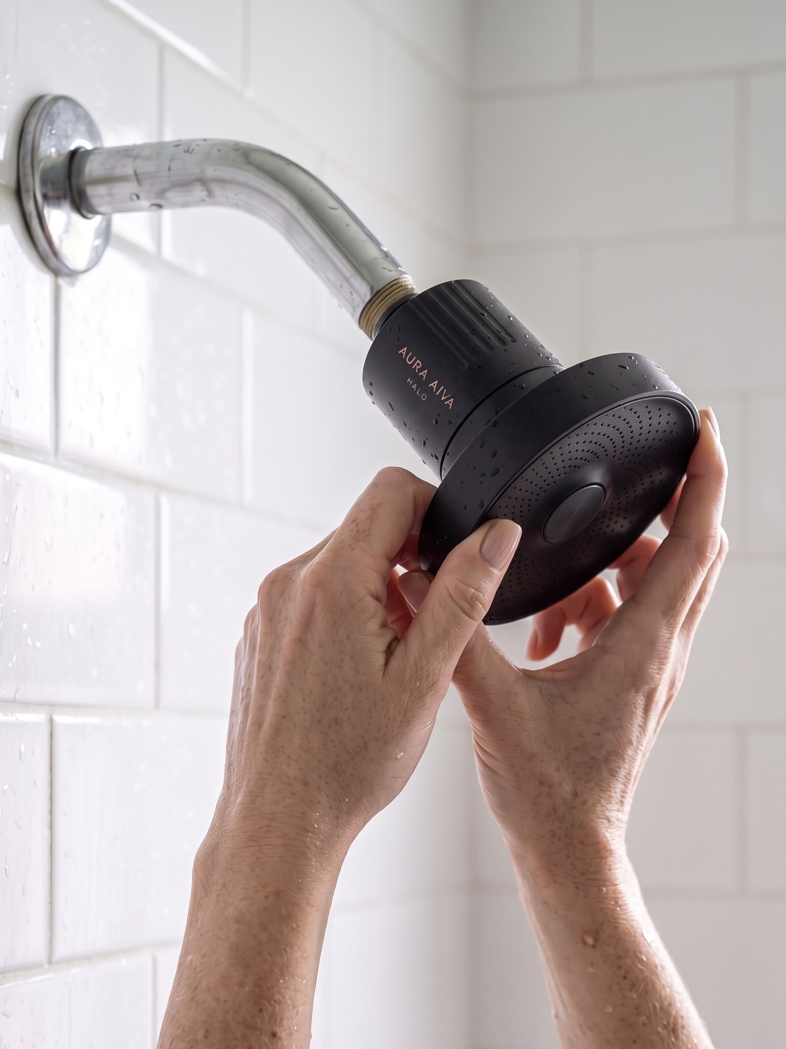 Threading the Halo onto the shower arm until snug